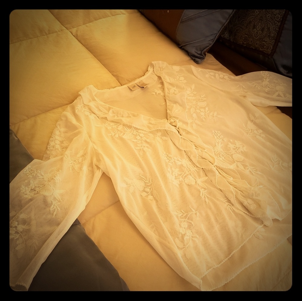 Cream colored embroidered blouse